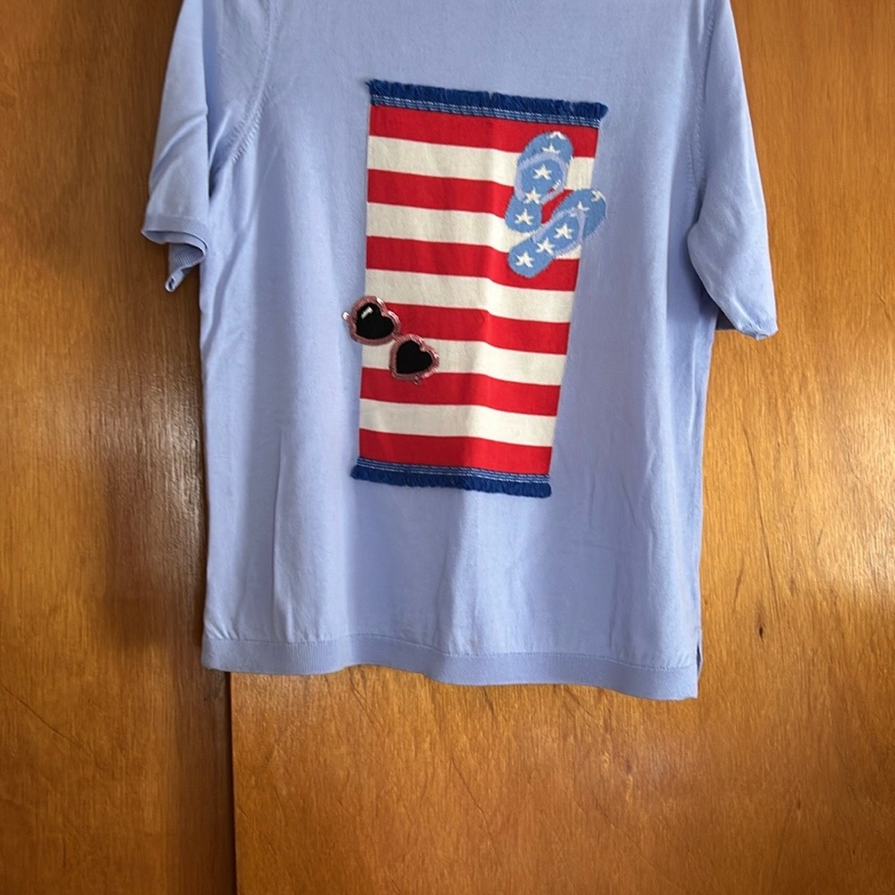 Blue woman's light weight sweater with American Flag Design